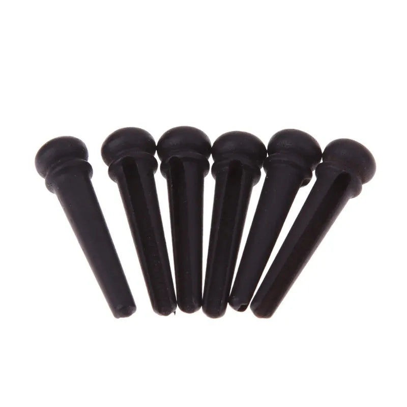 Six matt black ebony bridge pins for folk acoustic guitars with 5.3mm bayonet diameter