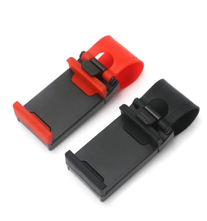 Black steering wheel phone clip holder mounted on car steering wheel