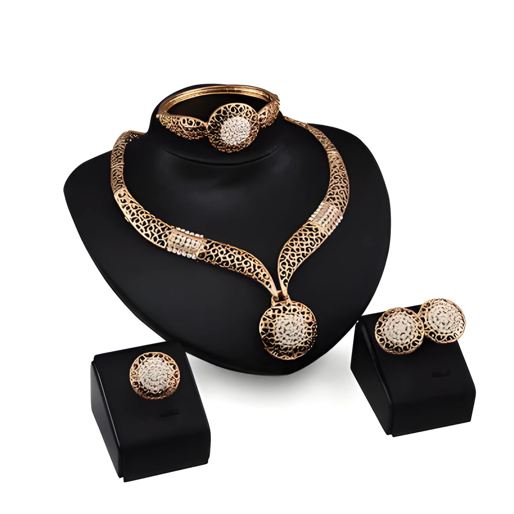 Gold jewellery four piece set with necklace, earrings, ring, and hand accessories featuring alloy and artificial gems