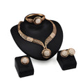 Gold jewellery four piece set with necklace, earrings, ring, and hand accessories featuring alloy and artificial gems