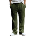 Man wearing loose-fitting straight leg casual trousers in army green, showing high waist and relaxed fit.