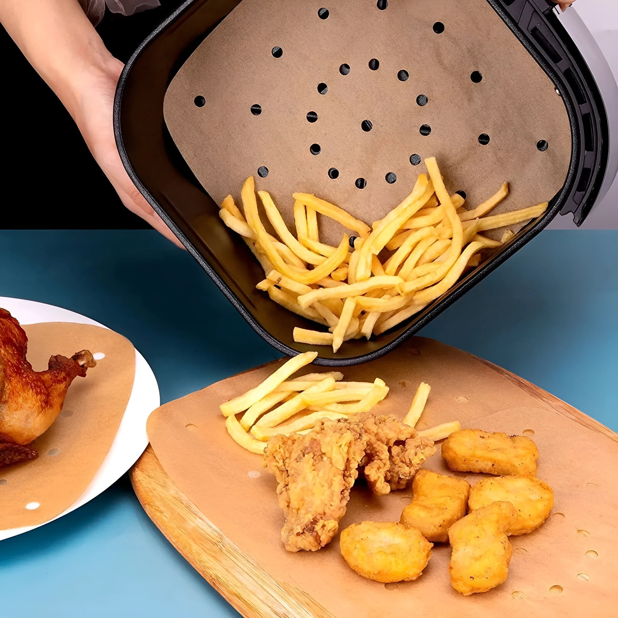 Stack of oiled paper square baking sheets with holes for air fryer use natural colour 20cm