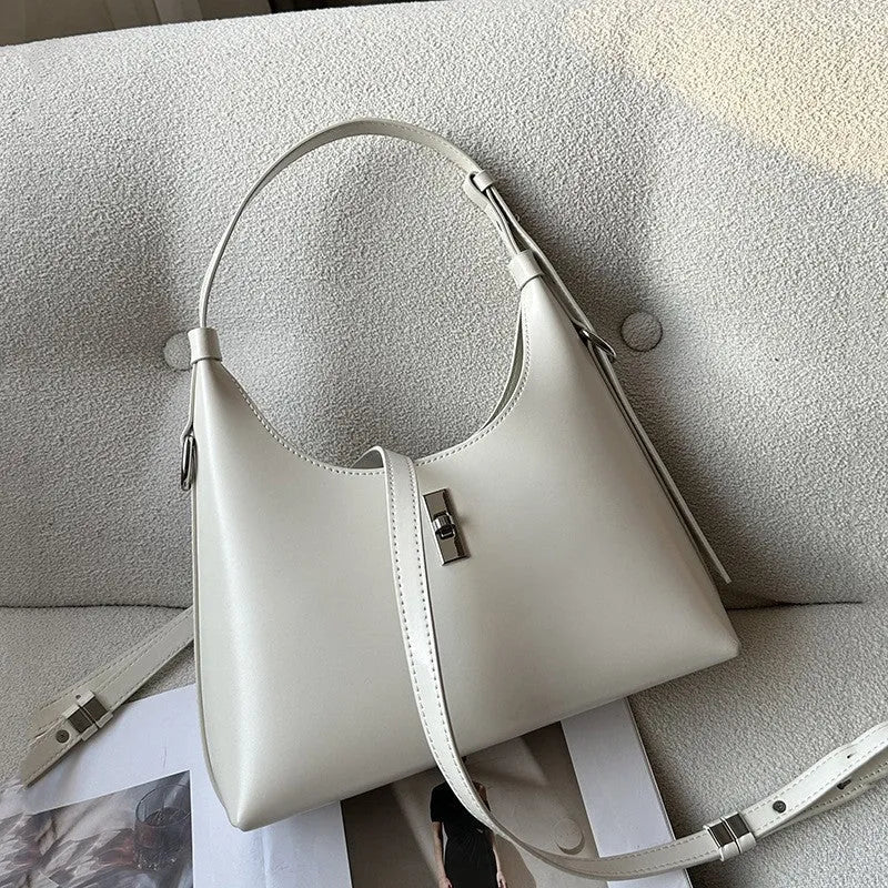 Women's dumpling-shaped crossbody shoulder bag in genuine cowhide leather with sandwich pocket and internal organisers