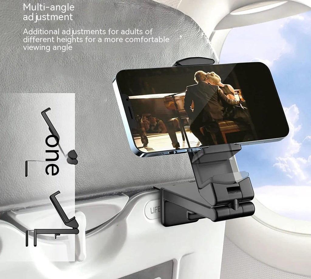Foldable rotating universal phone holder in black, green, and grey colours on a desk.