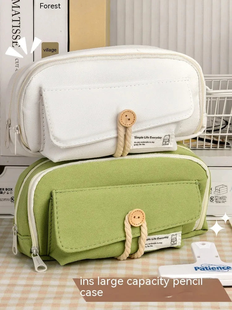 Canvas button pencil case in green colour showing large capacity for approximately 80 pens with Korean style design