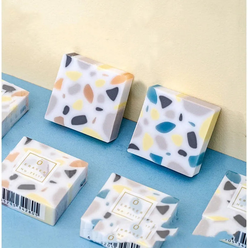 Brick-shaped solid rubber traceless eraser for pencil correction.