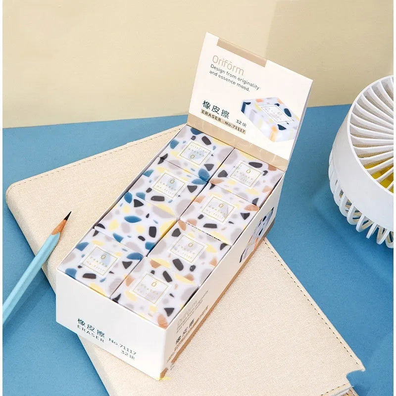 Brick-shaped solid rubber traceless eraser for pencil correction.