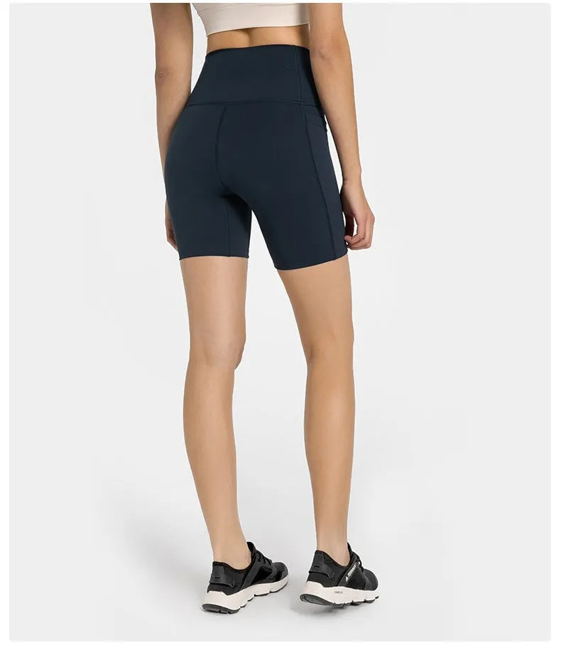 Women's tight black stretch sports shorts with cotton blend lining for running and fitness.
