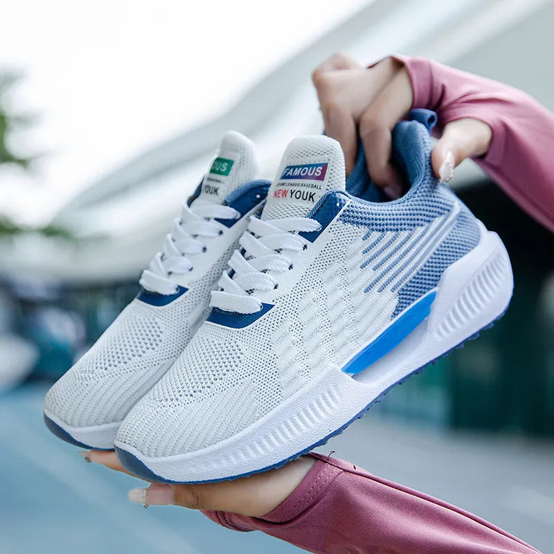Men's blue breathable mesh casual shoe with round toe and injection moulded sole.