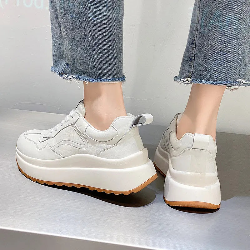 White women's cattlehide leather low-top casual sports shoes with a cross-strap and round toe.