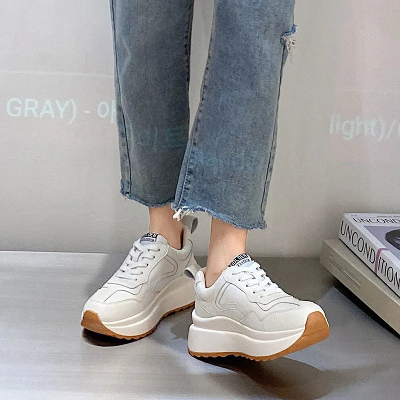 White women's cattlehide leather low-top casual sports shoes with a cross-strap and round toe.