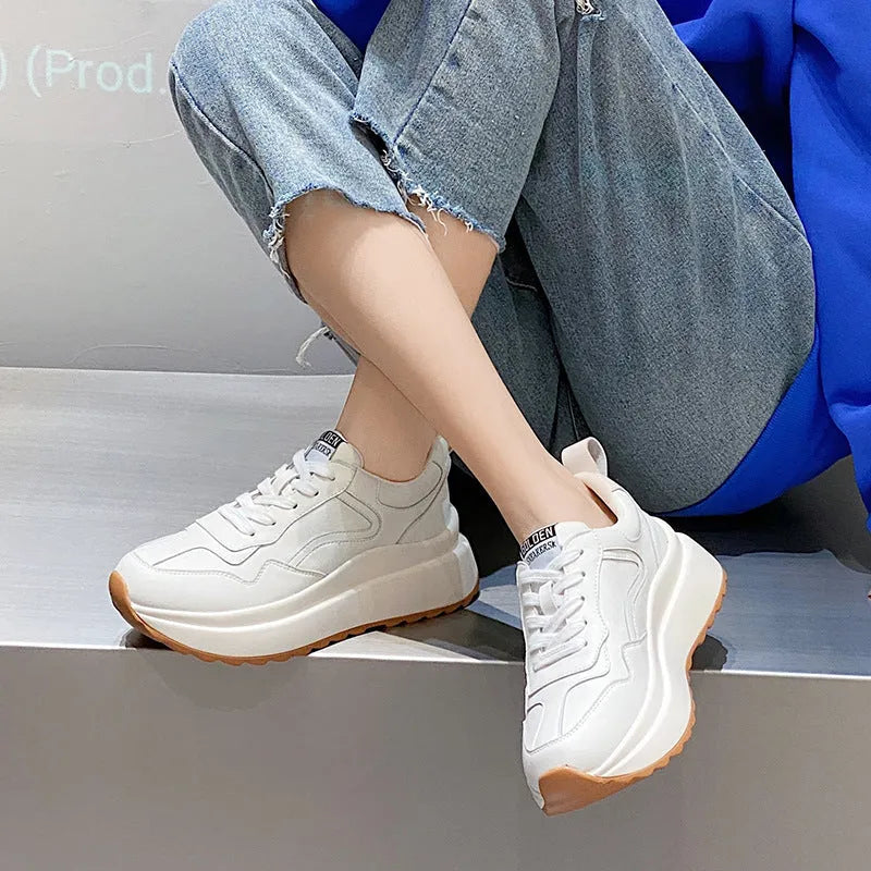 White women's cattlehide leather low-top casual sports shoes with a cross-strap and round toe.