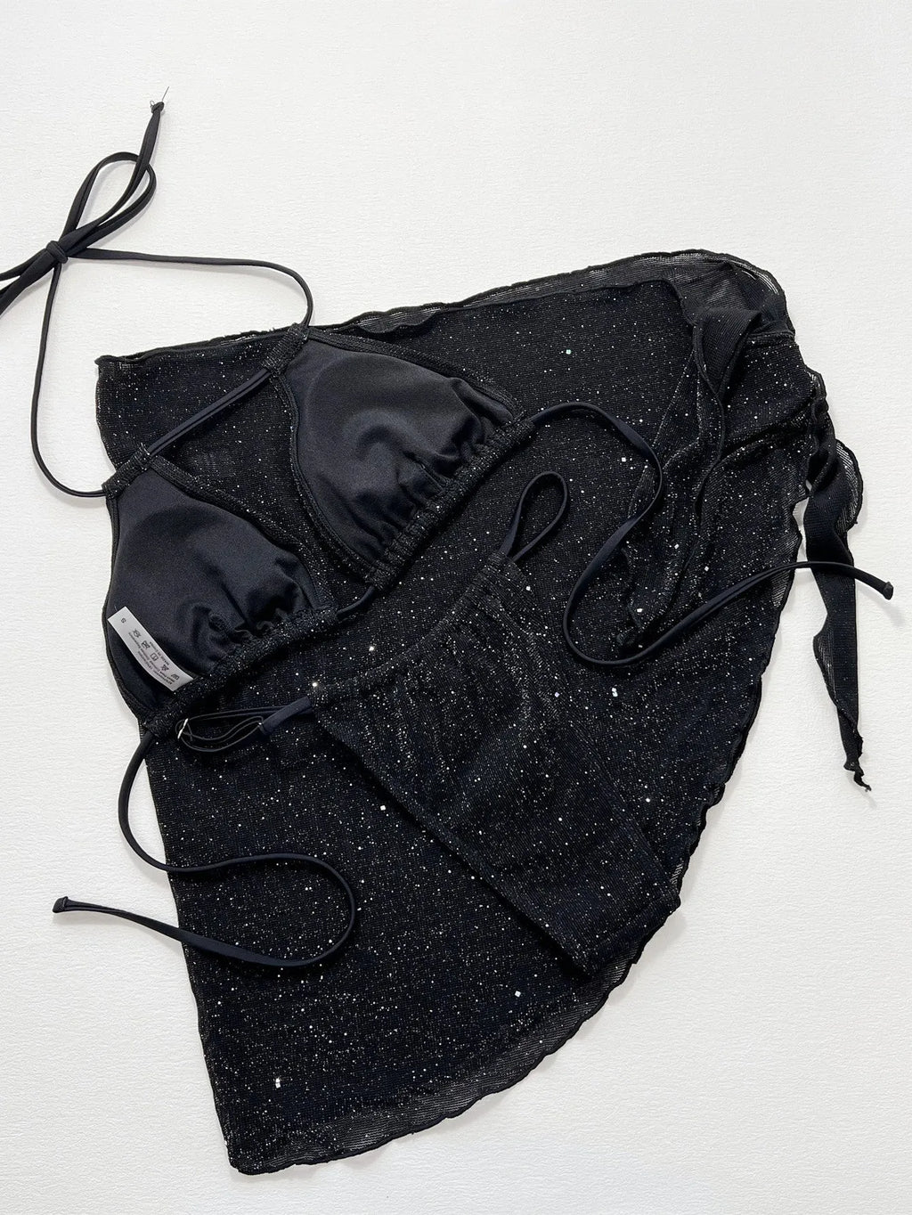 Black three-piece bikini swimsuit set with separate top and shorts