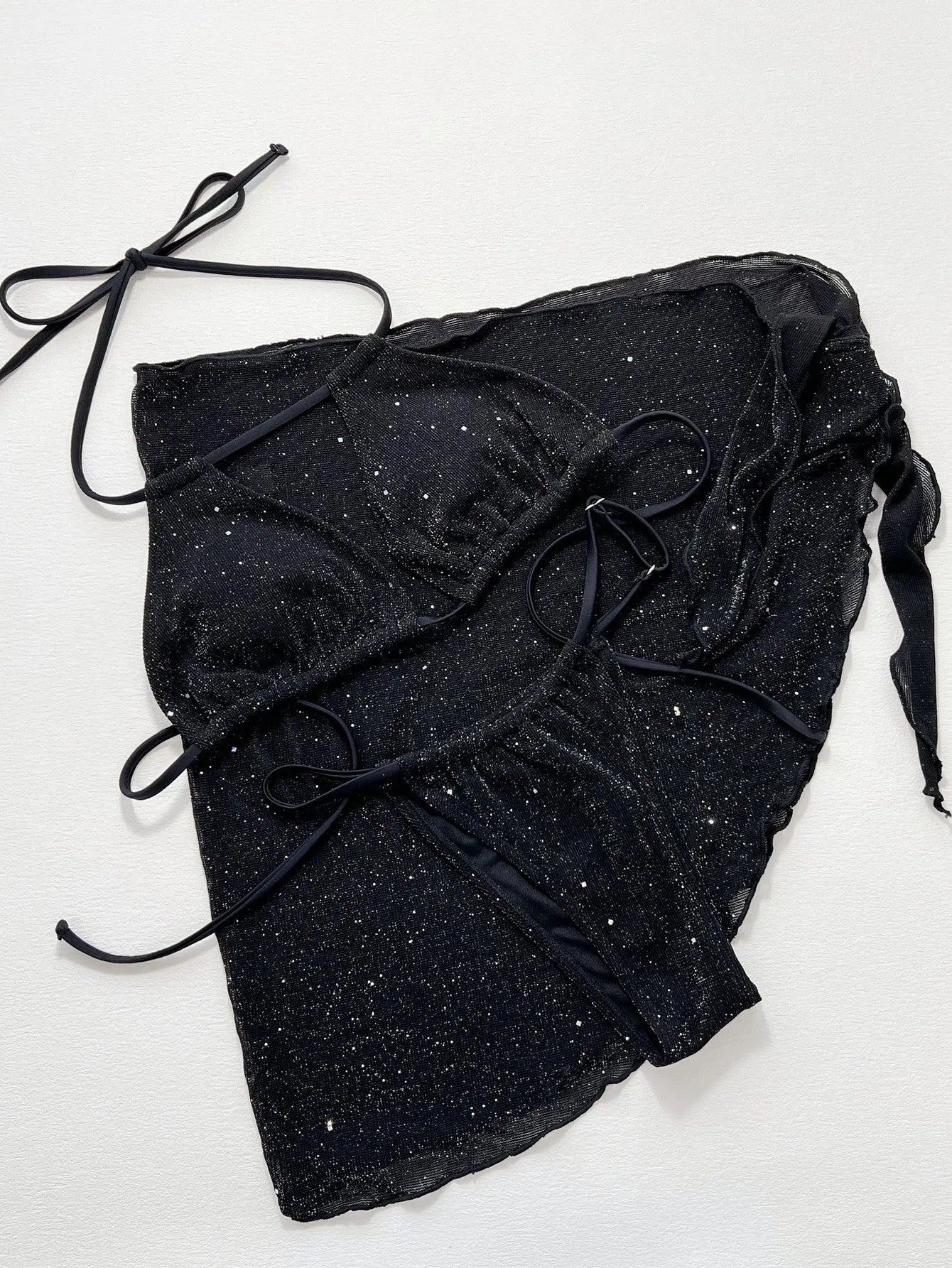 Black three-piece bikini swimsuit set with separate top and shorts