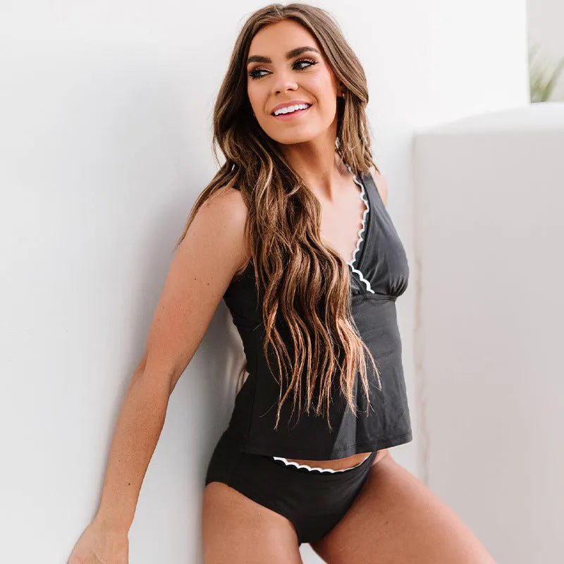 Black solid colour women's nylon bikini swimsuit on a white background