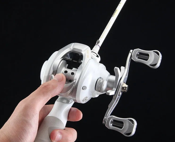 Small white ET Drop Wheel bait casting fishing reel showing drip wheel design