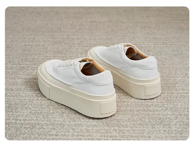 Women's tied platform sports board shoes in black with round toe, cowhide upper, and rubber sole