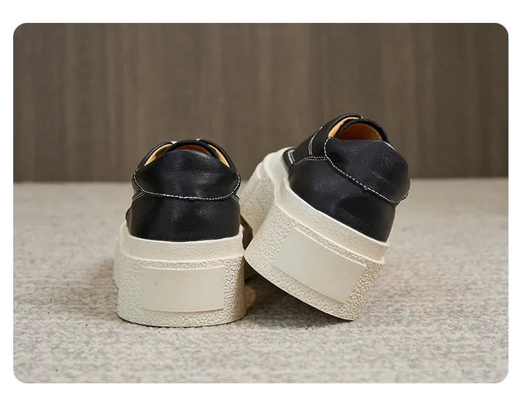 Women's tied platform sports board shoes in black with round toe, cowhide upper, and rubber sole