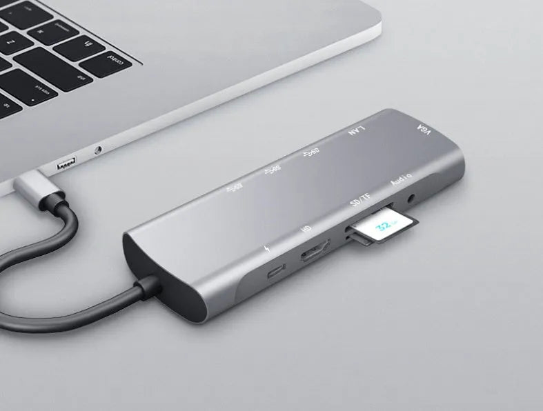 Grey aluminium alloy USB-C docking station with HDMI, VGA, USB 3.0, and Power Delivery ports