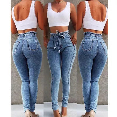 Woman wearing grey fringed straight leg jeans made from cowboy denim fabric.