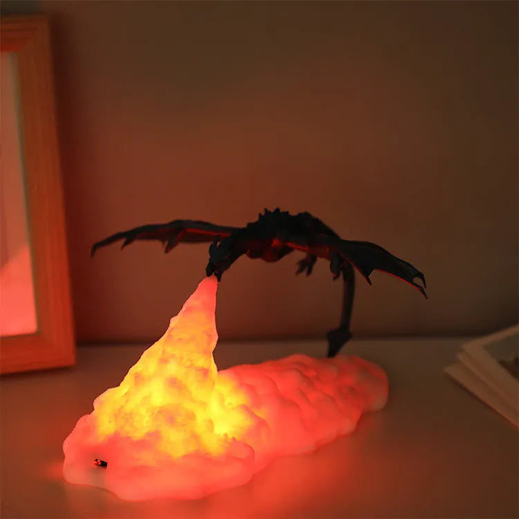 3D printed red dragon night light glowing on a table with USB cable
