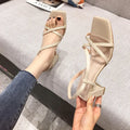Women's white thick heel sandals with a one-word strap, open back, and 8cm heel.