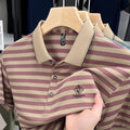 Men's striped casual short sleeve shirt with mosaic detailing in blue, shown on a model