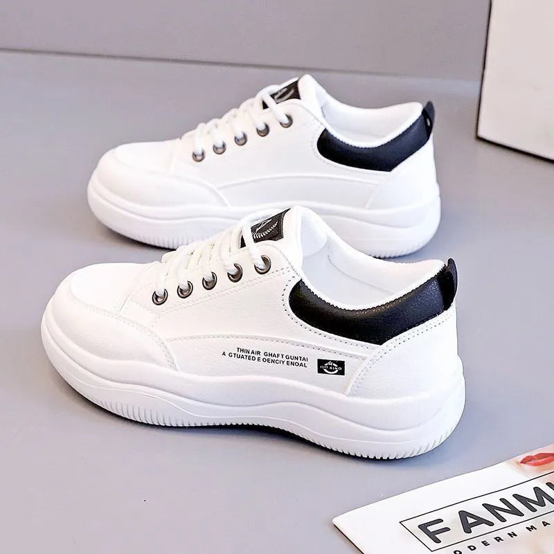 Women's white Korean style pumps with cross straps and lace-up design showing round toe and mid heel