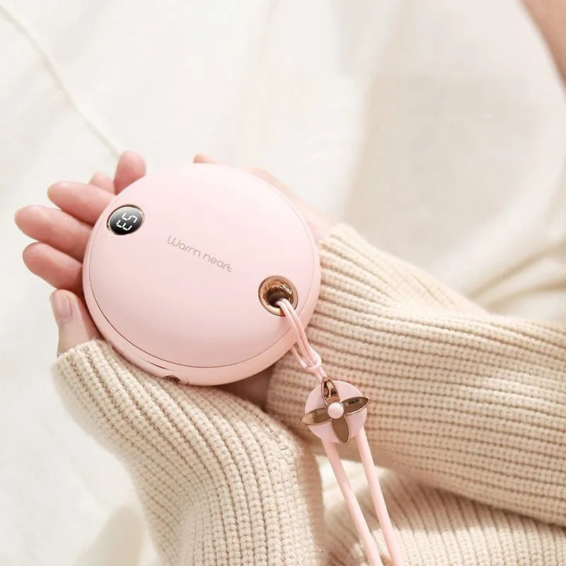 Green portable power bank with hand warmer function showing digital display and Type-C port