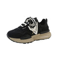 Retro platform sports shoes in black with round toe, front lace-up, rubber sole, and mesh lining