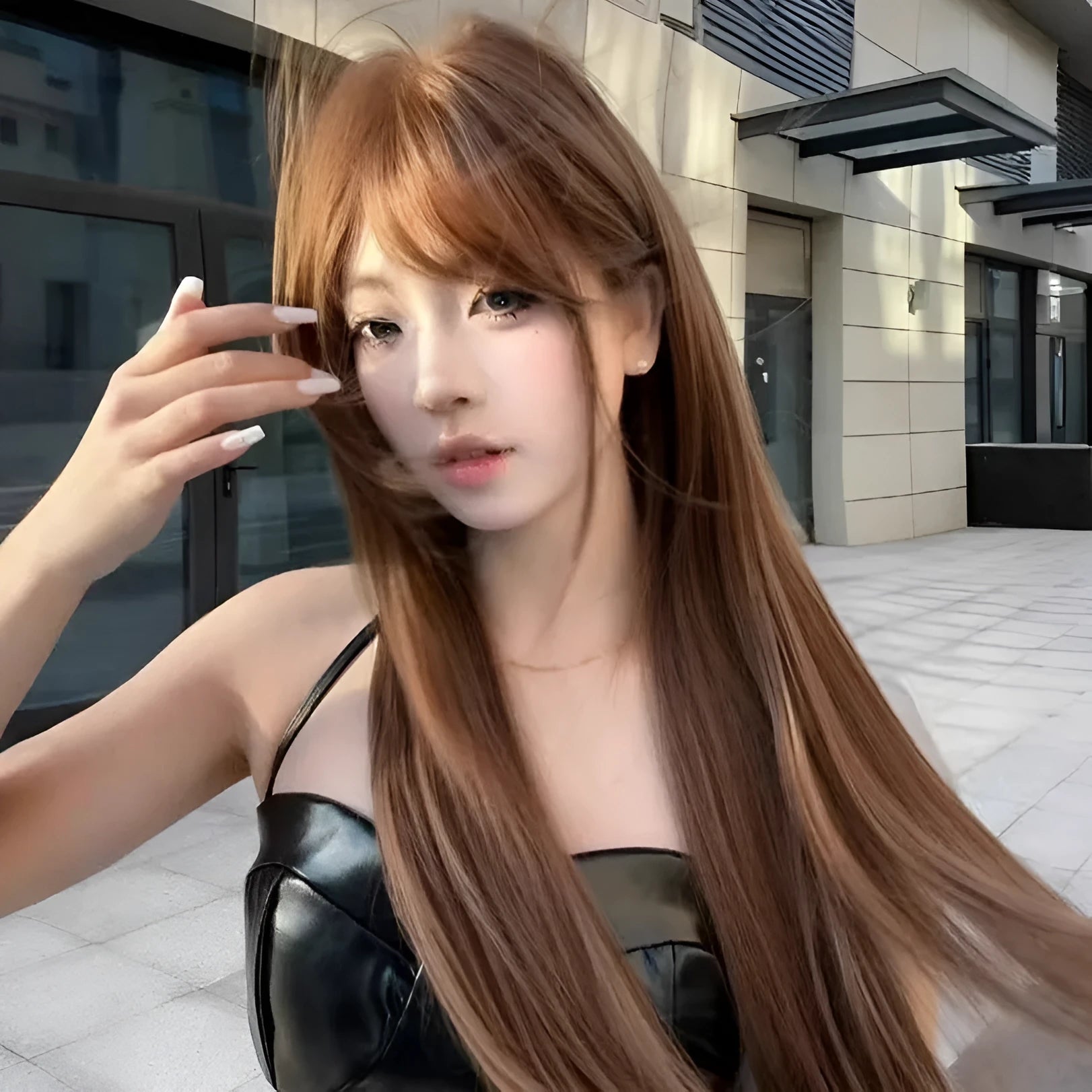 Long straight warm brown wig with bangs for women on a mannequin head showing full length and natural colour