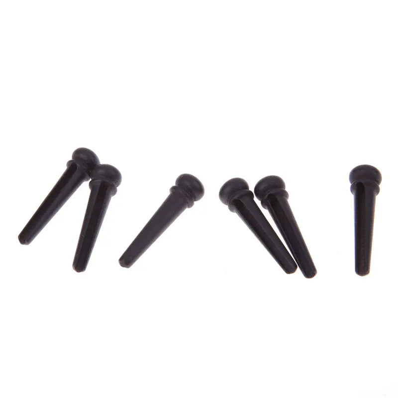 Six matt black ebony bridge pins for folk acoustic guitars with 5.3mm bayonet diameter