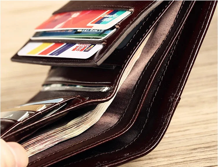 Men's leather wallet showing multiple internal compartments including card slots and change purse