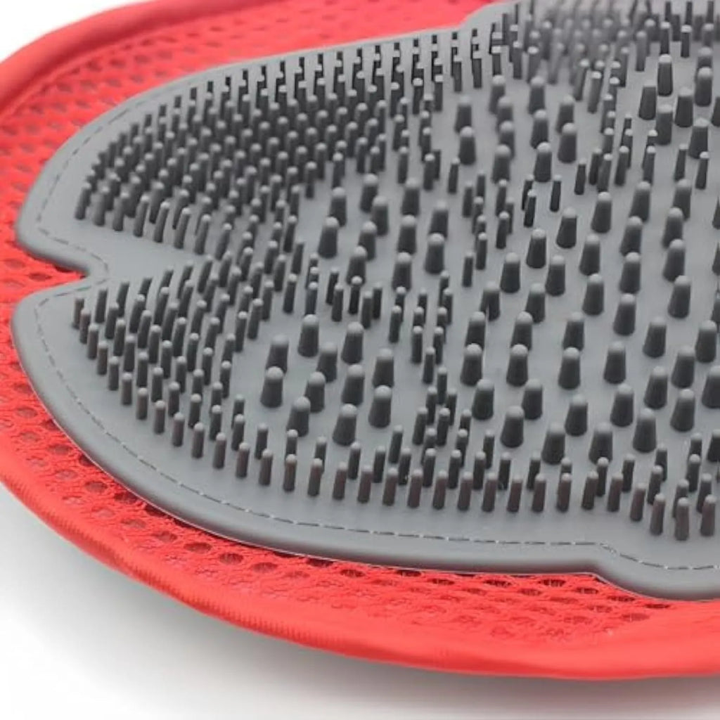 Red pet bathing glove with integrated brush for grooming and hair removal during pet baths.