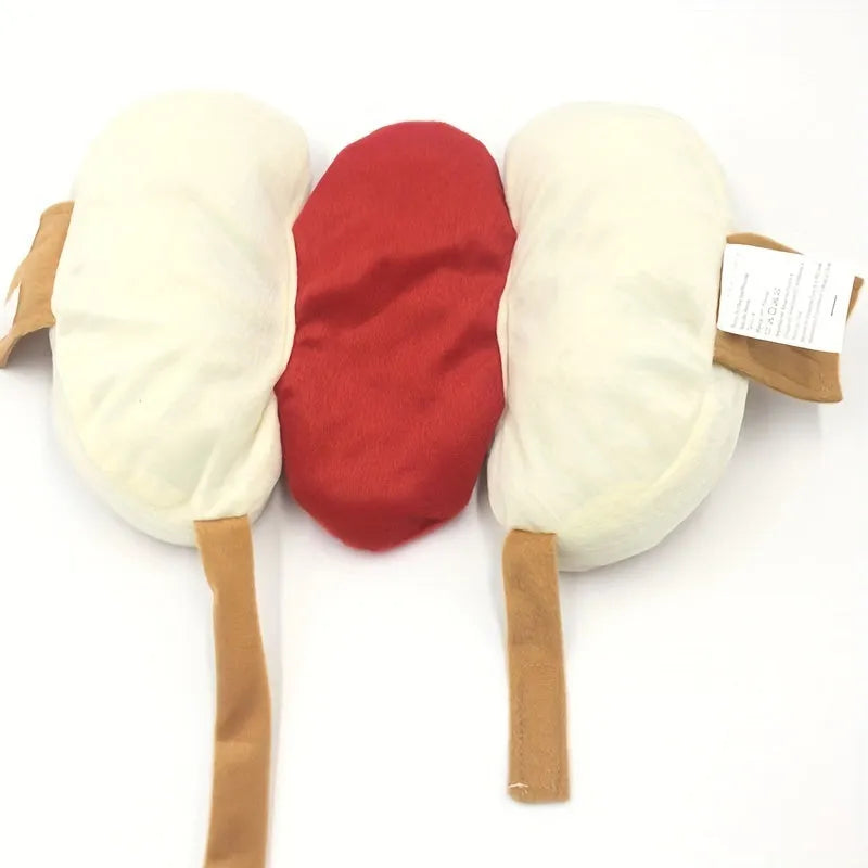 A small dog wearing a plush red and brown hot dog costume with elastic straps.