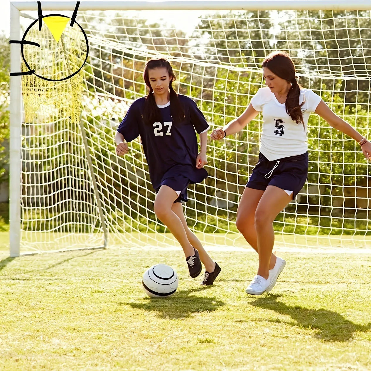 Portable soccer training goal net in black, used for practice shooting drills on grass