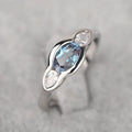 Geometric ellipse ring with inlaid zircon stones in white gold colour finish