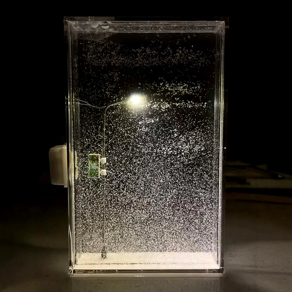 DIY material kit for building a snowy landscape night light with small street lamp and LED effects.