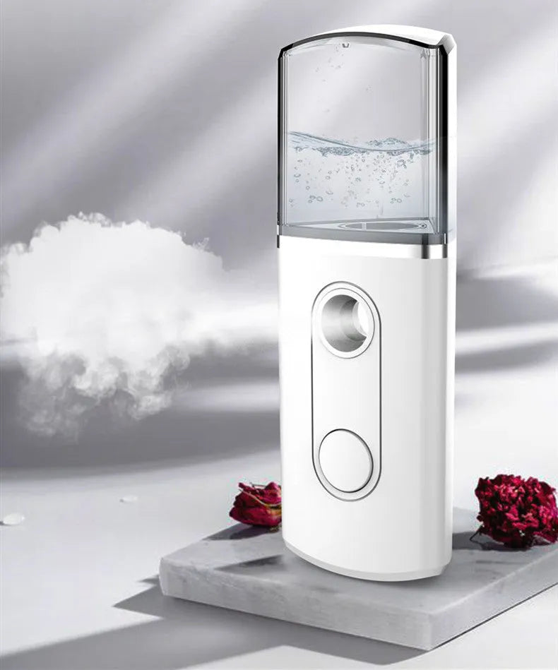 Portable facial nano mist humidifier in white, 10cm long, with 20ml water tank and USB cable