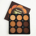 Dark matte makeup palette showing nine earthy colours with compact case and repair disk