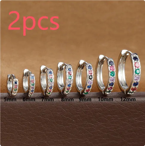 Round zircon perforated stud earrings in gold, rose gold, or silver colour with geometric design