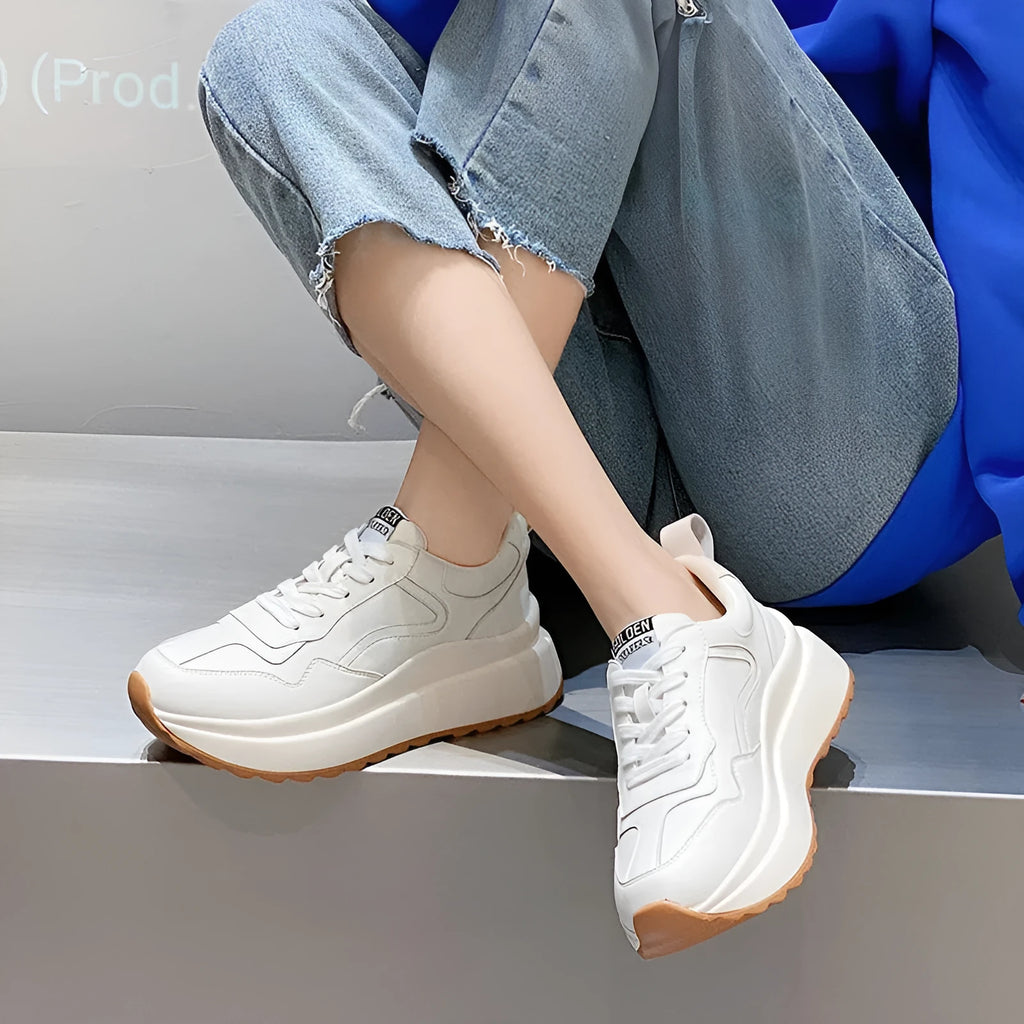 White women's cattlehide leather low-top casual sports shoes with a cross-strap and round toe.