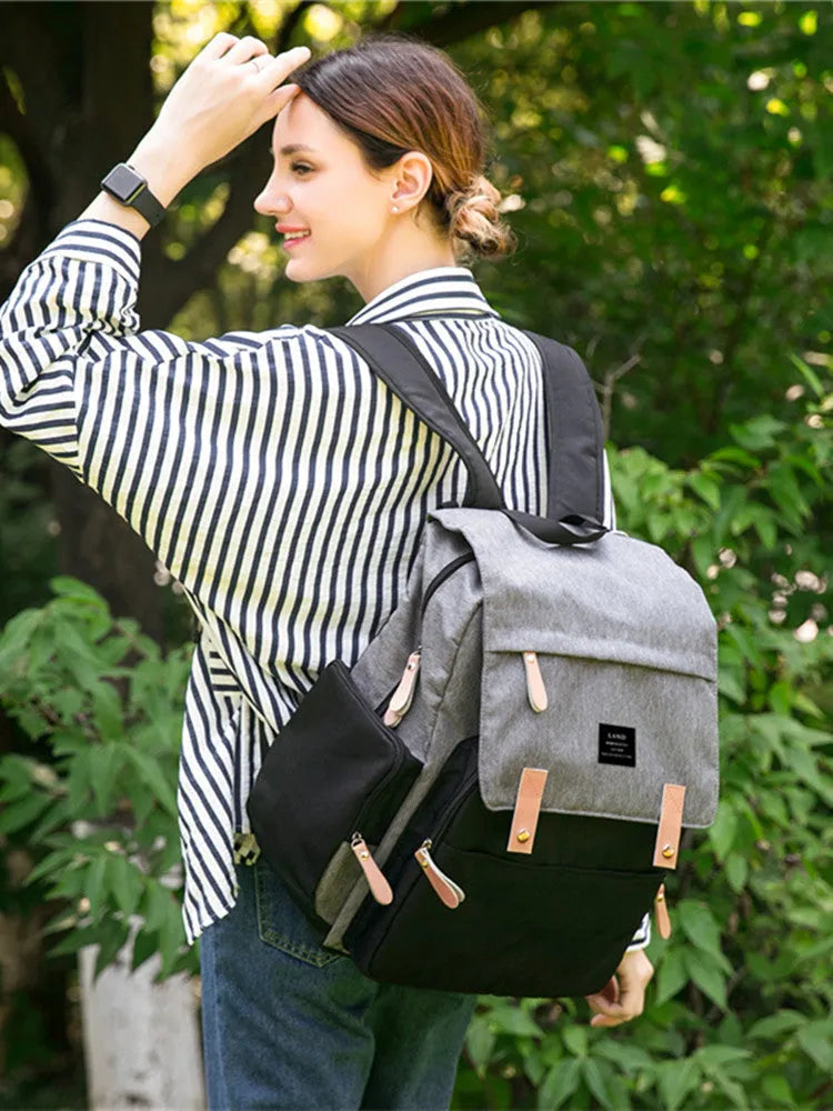 LAND Mommy Diaper Backpack in oxford cloth with changing mat, shown in grey colour.