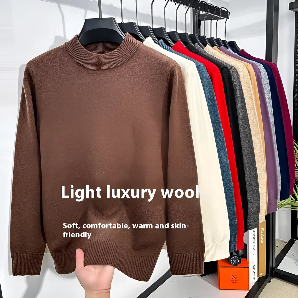 Man wearing a fine wool half turtleneck sweater in a solid colour, showing the regular fit and pullover style.