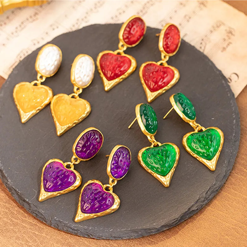 Silver needle pleated oval love heart stud earrings in purple, red, green, and yellow/white alloy colours.