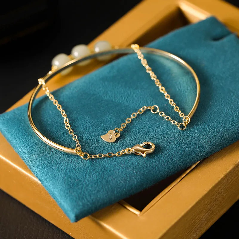 Hetian jade lucky beads bracelet with gold inlay, shown in single, double, and three bead versions.