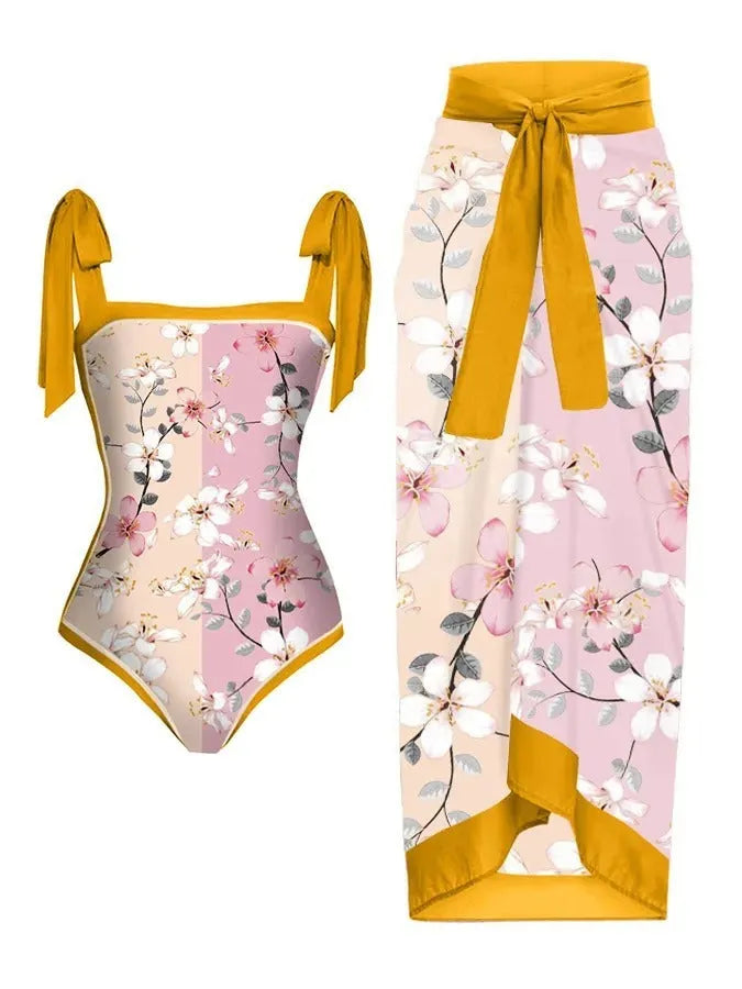 Women's printed two-piece chiffon swimsuit with matching hip skirt in a floral design.