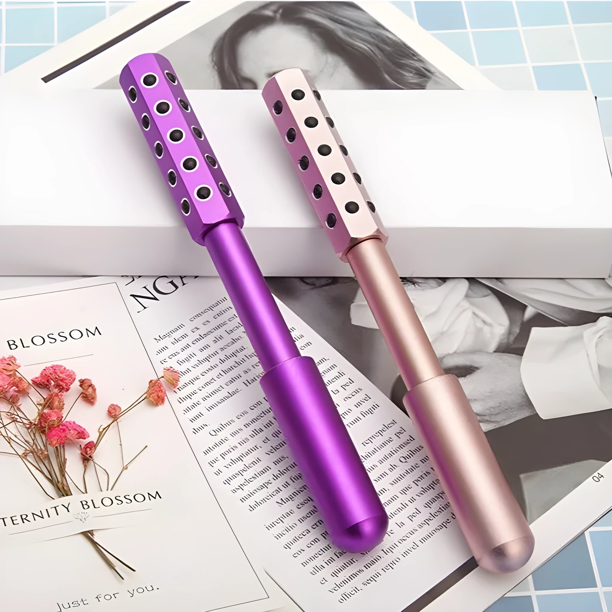 Purple handheld roller massage instrument with 24 germanium ceramic beads for facial and eye care.