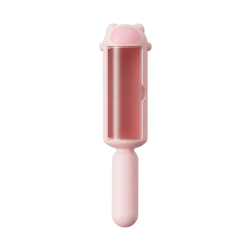 Blue pet hair remover tool with self-cleaning base on a sofa with dog fur