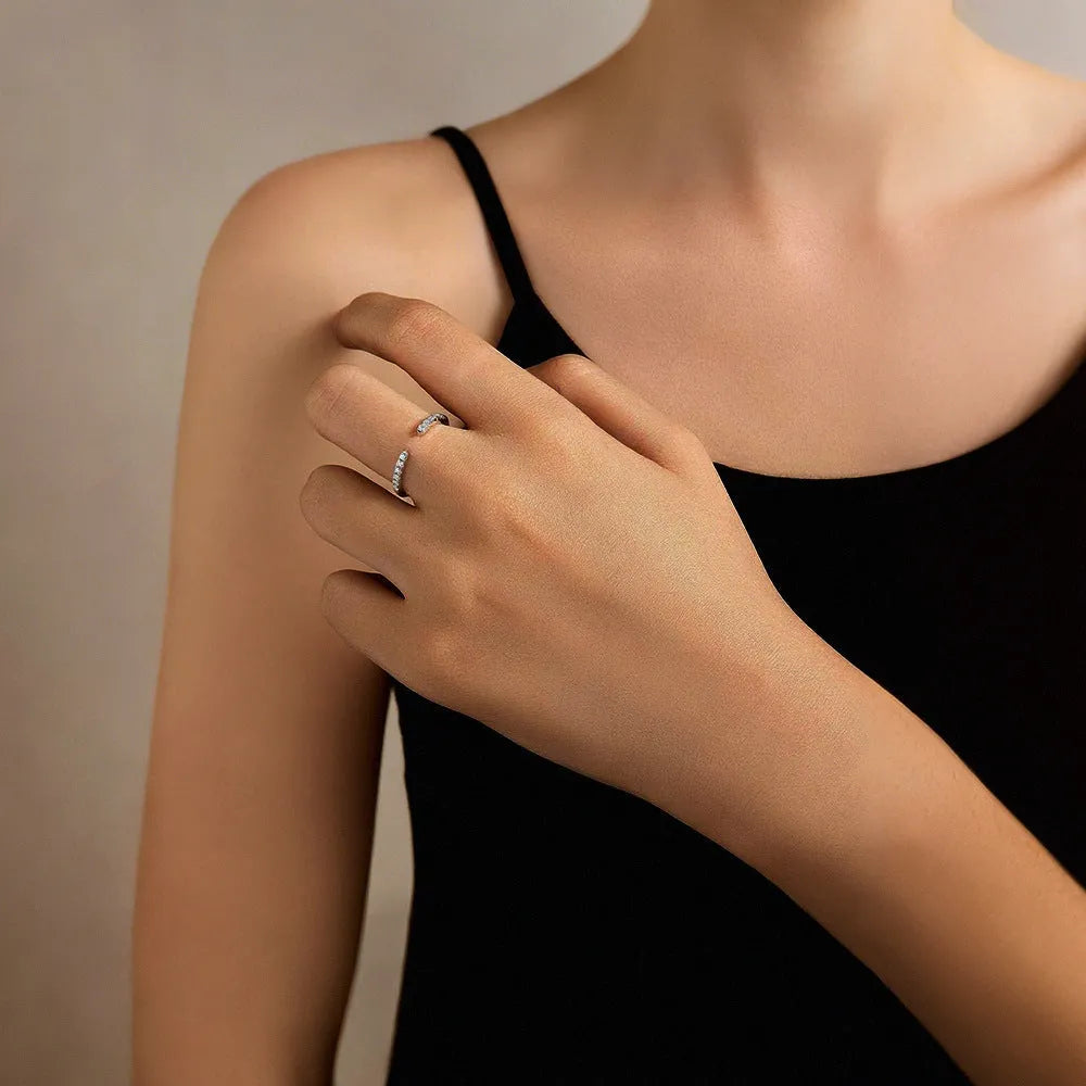 Silver adjustable geometry ring with electroplated platinum rehearsal diamond finish on finger